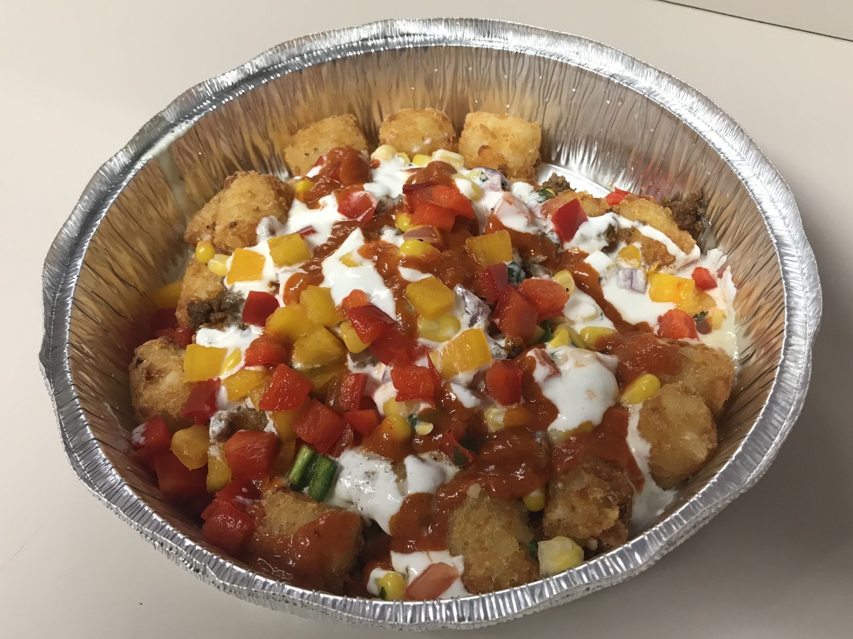 Smothered tots at Solsa American Burrito Company